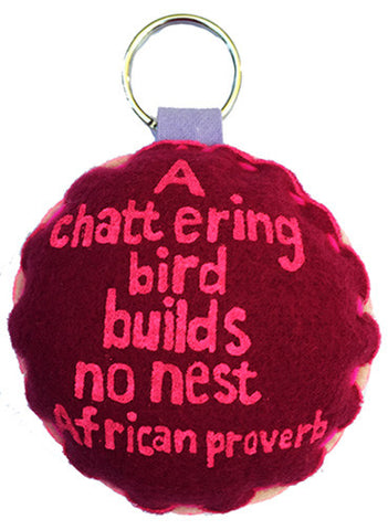 Handcrafted African Proverb two-toned felt keychain featuring image of a bird with text